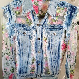 New Adore enchanting denim jacket adorned with vibrant floral embroidery.